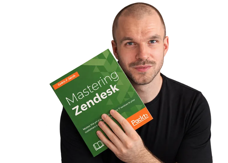 Cedric F. Jacob holding his book Mastering Zendesk